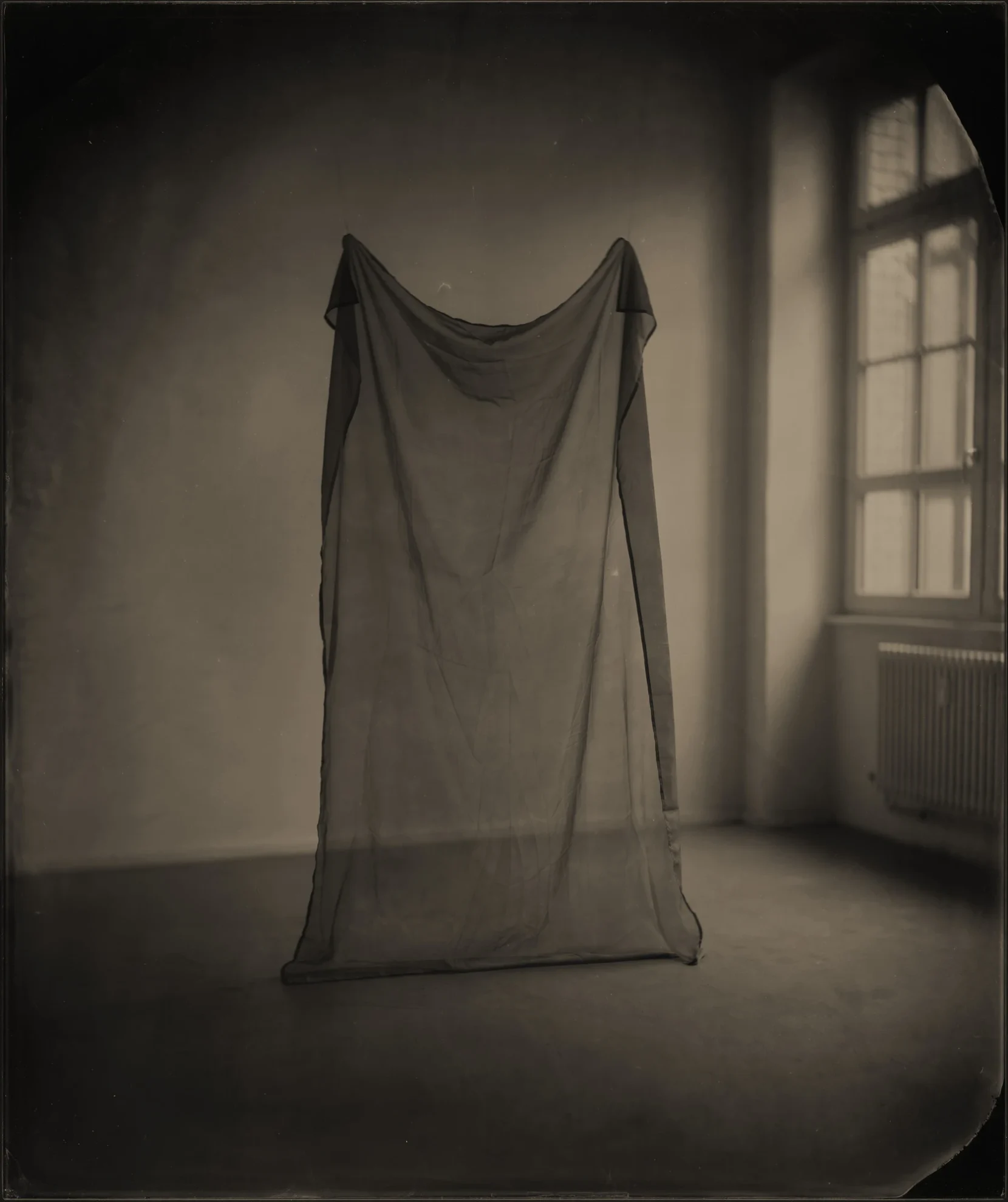 This image depicts a photograph by artist Ben Cauchi titled 'The Thin Veil', an artwork made in 2013. The medium is ambrotype. The size of this artwork is 43x36 cm. This artwork was first shown in the exhibition 'One's Own Grey' at Künstlerhaus Bethanien in Berlin in 2013.
